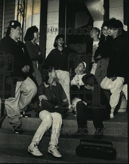 1992, Teenagers at porch party talking, sharing jokes and dance. - Historic Images