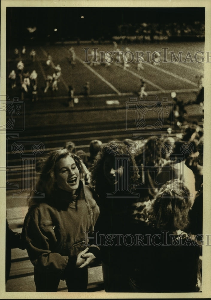 1989 Press Photo At Whitefish Bay High, socializing a part of football games.- Historic Images