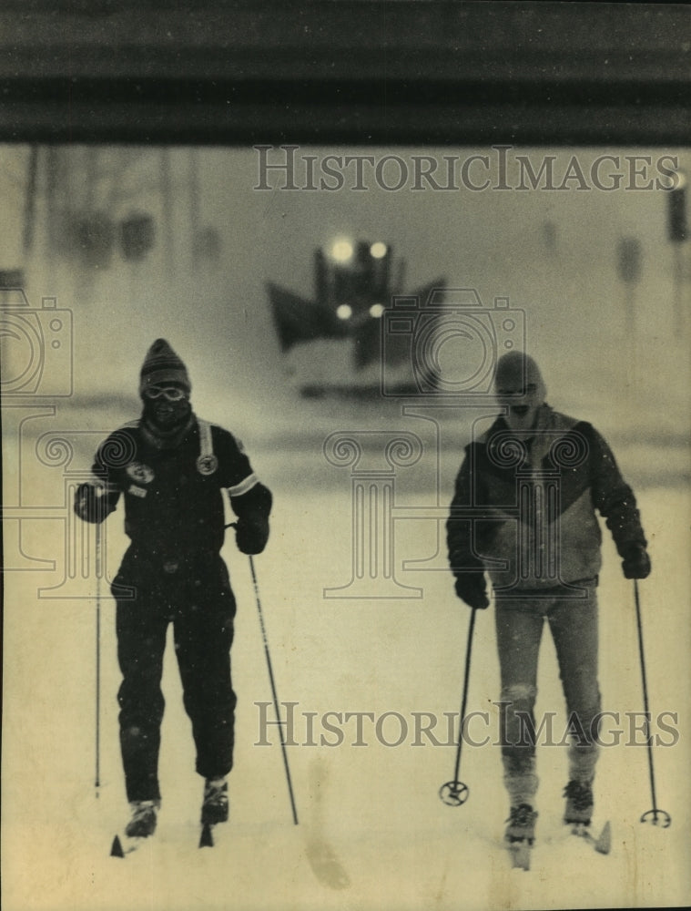 1985, David Burton and Brad Torbeck ski on road in Appleton Wisconsin - Historic Images