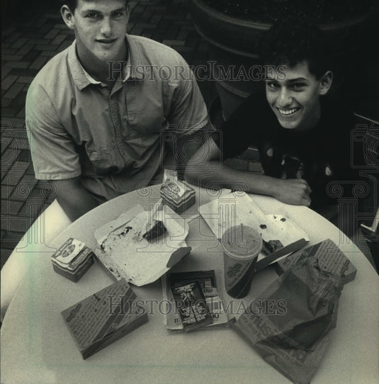 1986 Smiling Mike Laidlaw and Friend Sitting at Table - Historic Images