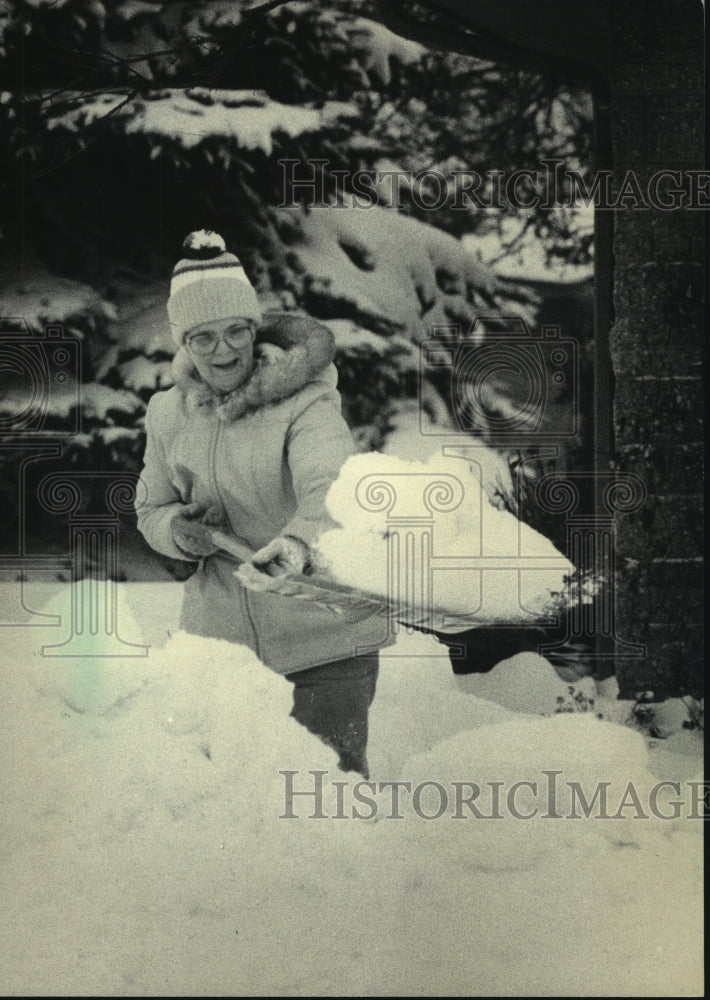 1995, Joyce Popelka starts new year by shoveling snow in Wauwatosa - Historic Images