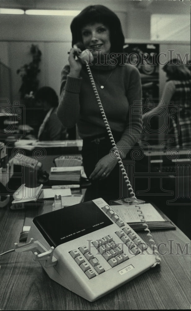 1978 Debby Fink demonstrates phone system, Harley-Davidson Motor Co. - Historic Images