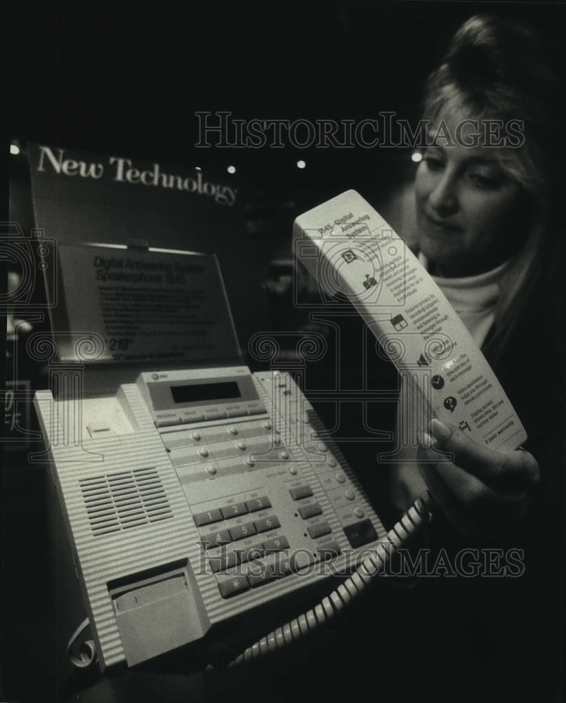 1993, Tammy Walker, Milwaukee, demonstrates Digital Answering phone. - Historic Images