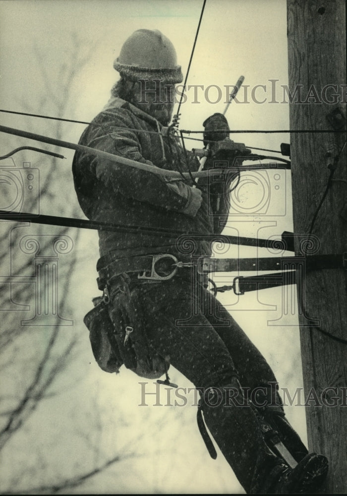 1984, Tim Pepin installs cable line in Negaunee, Michigan - mjc06530 - Historic Images