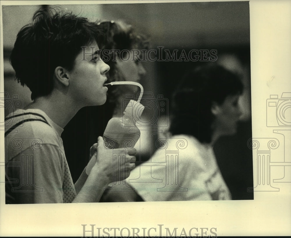 1987 Becky Persins takes a break, Pius XI High School, N. 76th St. - Historic Images