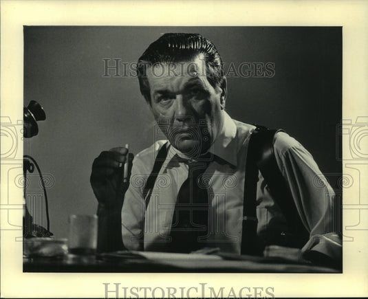 1985 Man Smoking Cigarette in a Television Commercial - Historic Images