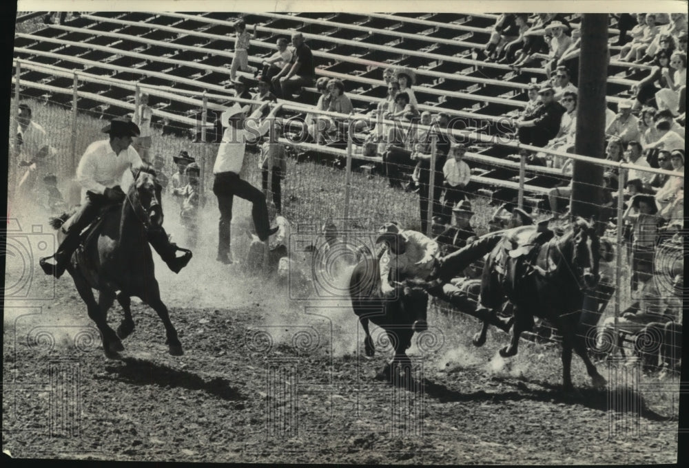 1963 Press Photo Cowboys Wrestle Steer at the Wonago Rodeo in Wisconsin - Historic Images