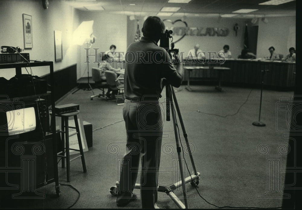 1983, Donald Dugan filming Village Board meeting for cable television - Historic Images