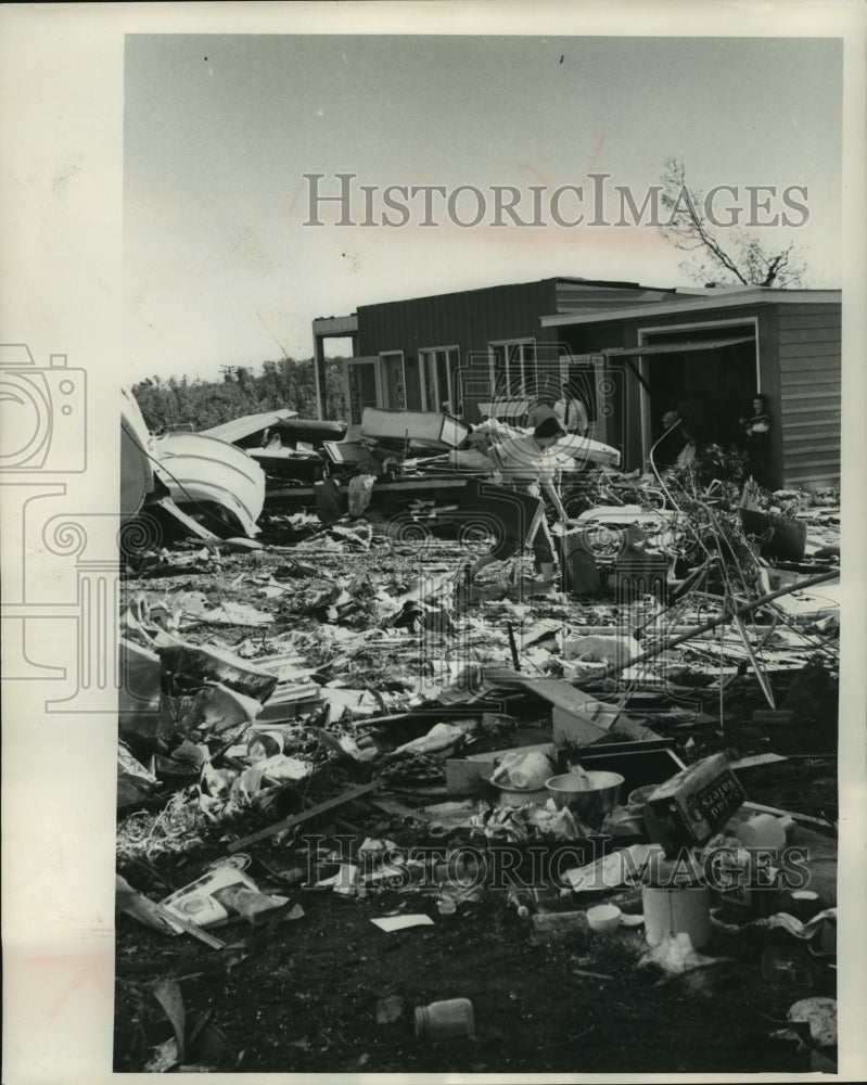 Press Photo Chippewa Falls Storm Debris, Mrs. Bill Starr of Tulsa picks her way - Historic Images