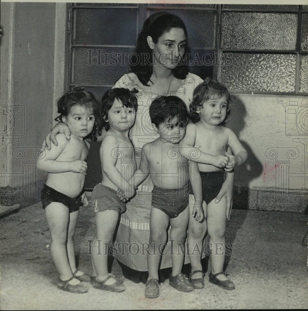 1965, Argentine quadruplets with their mother in Buenos Aires - Historic Images