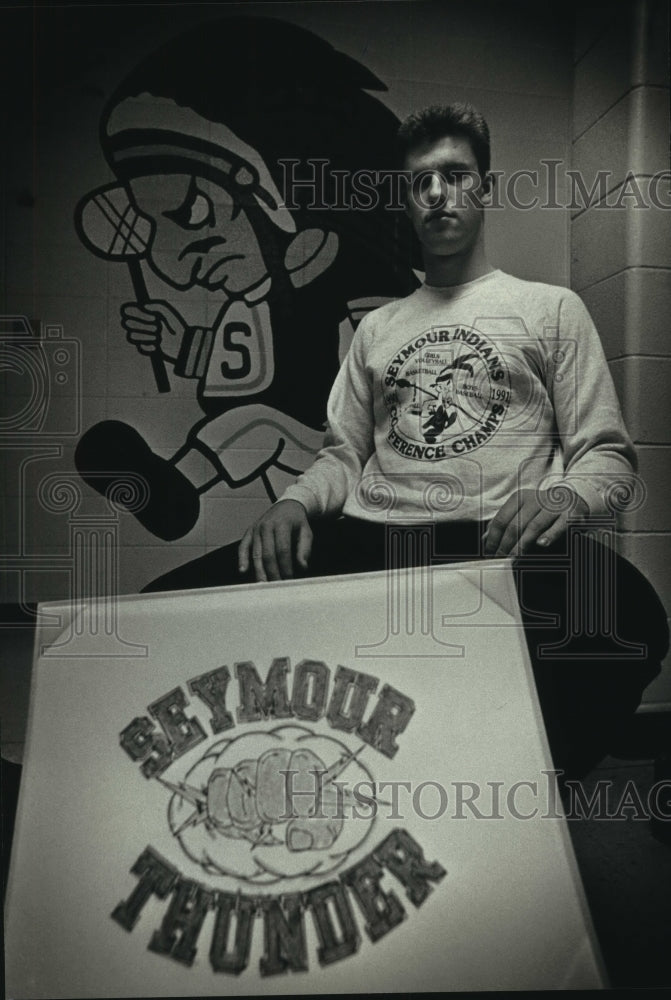 1992 Press Photo Dave Nagel, Seymour High School sits by school&#39;s new nickname - Historic Images