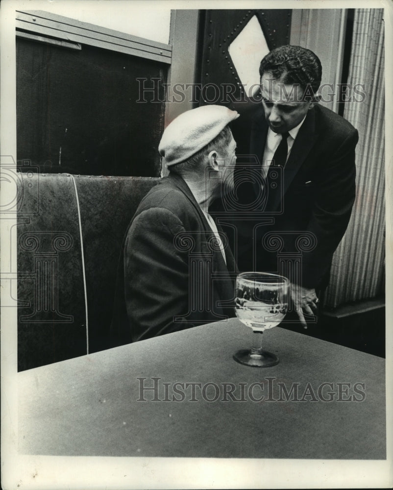 1960, Milwaukee Judge Christ Seraphim talks to bar patron - mjc07473 - Historic Images