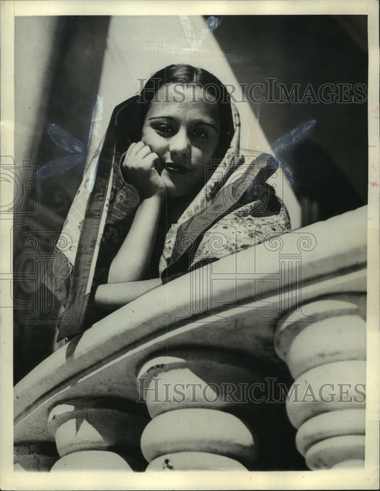 1936 Press Photo Girl watches street procession from window balcony in Lisbon - Historic Images