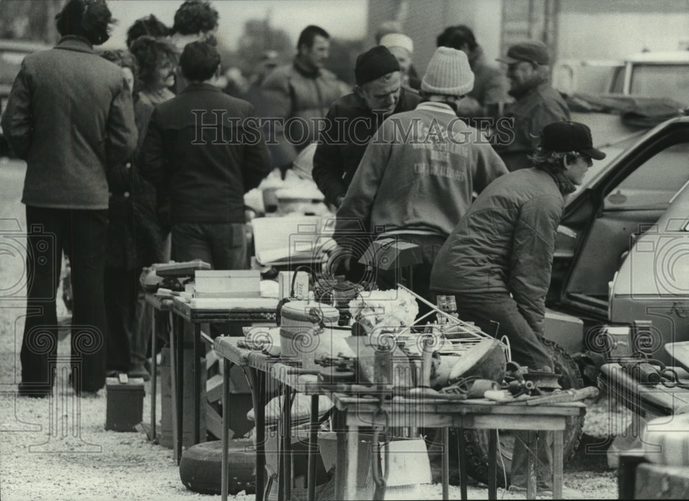 1975, Visitors to the Seven Mile Fair looked at antiques and junk - Historic Images