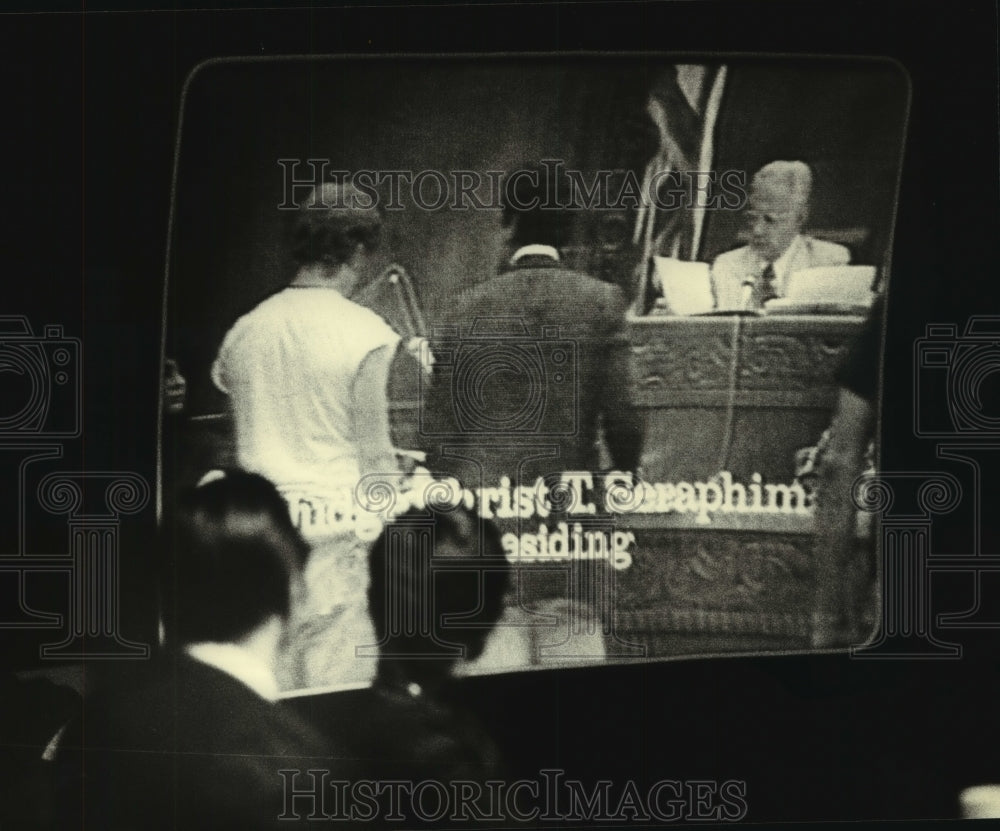 1980, Prosecutors watching TV tape of Seraphim hearing in court - Historic Images