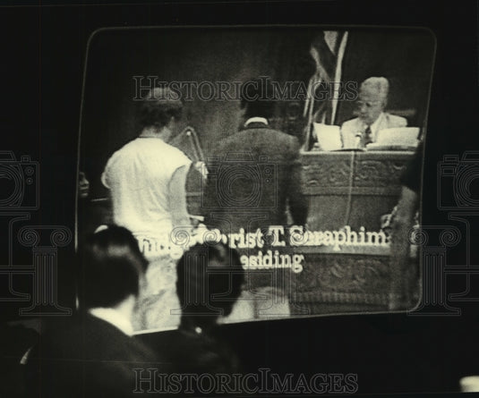 1980, Prosecutors watching TV tape of Seraphim hearing in court - Historic Images