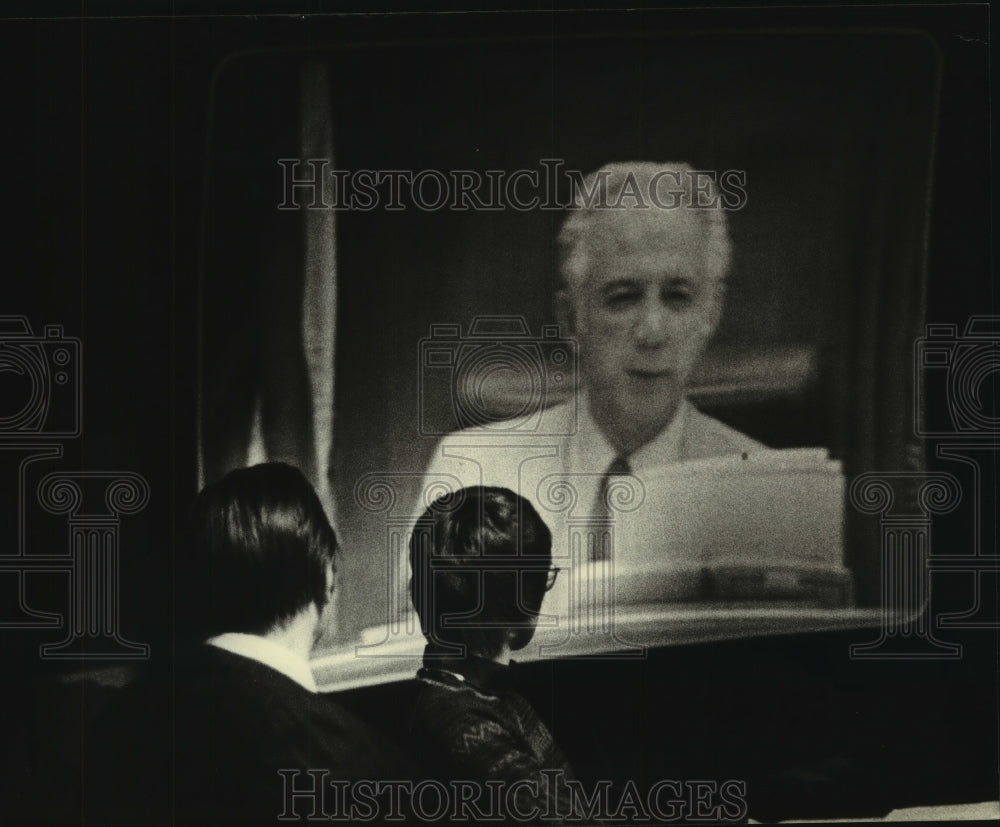 1980, Prosecutors watching Television tape of Seraphim in court - Historic Images