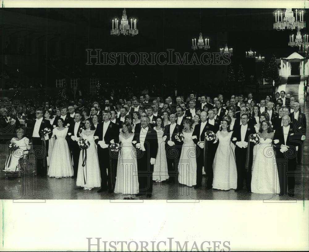 1982 Debutantes and their fathers in a grand march at Charity Ball - Historic Images