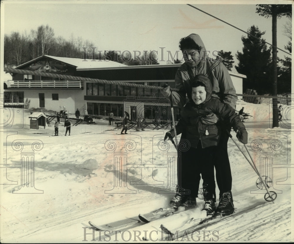 1962, Chippewa Indian Patsy Mike gives Frances Wise ride up rope tow - Historic Images