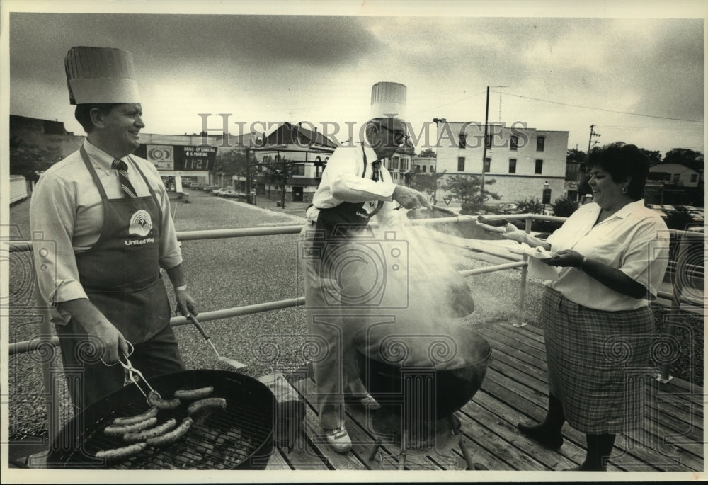 1991, Waukesha State Bank employees treated to lunch on rooftop deck - Historic Images