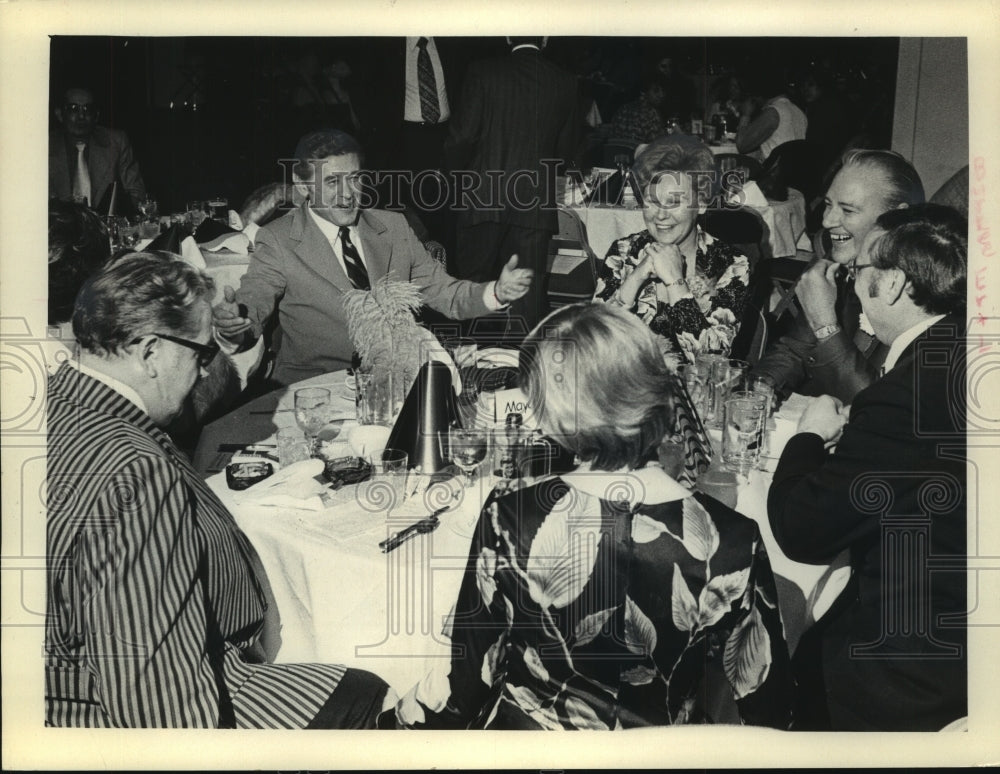 1975, Henry Maier at New Years Eve party with group of friends. - Historic Images