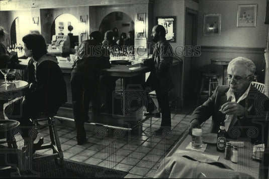 1985, Judge Christ Seraphim Eating Lunch at Peter's Pub and Grill - Historic Images