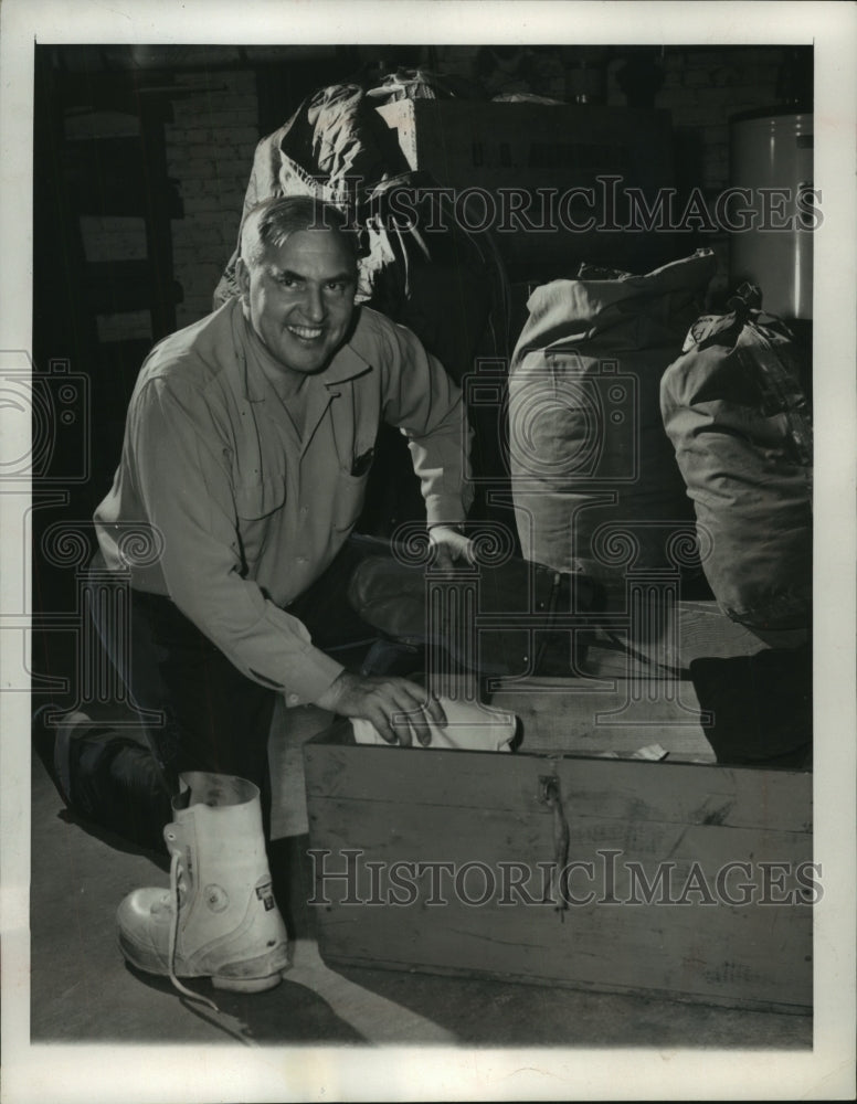 1956, Dr. Paul Sipel packs for his sixth polar trip - mjc08515 - Historic Images