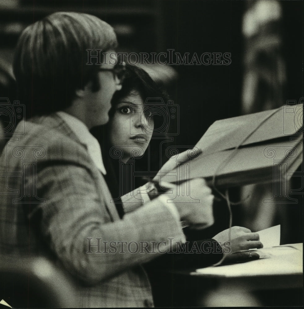 1979, Valencia M. Vallejo sits with her attorney during her hearing - Historic Images