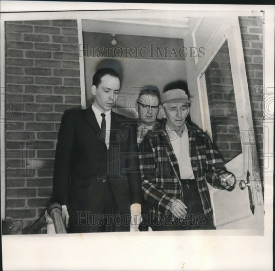 1960, Charles Ulrich leaving courtroom with district Atty., Sheriff. - Historic Images