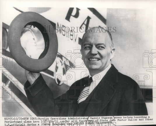 1954, Harold Stassen waves before boarding plane bound for Paris - Historic Images