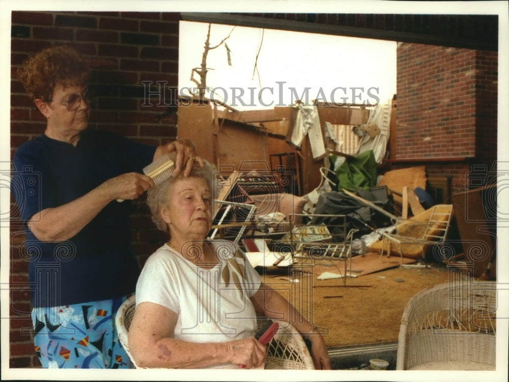 Press Photo Mary Martha Clarkson brushes glass from sister's hair-Tornados - Historic Images