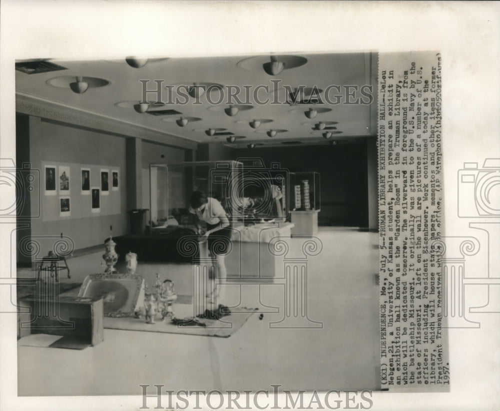 1957, DeLou Nebgen helps prepare an exhibit in the &quot;Garden Room&quot; - Historic Images