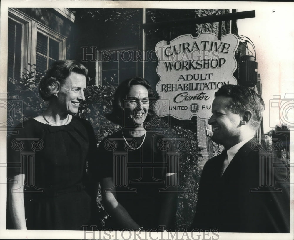 1965, Allen Taylor, president, Curative Workshop greets Junior League - Historic Images