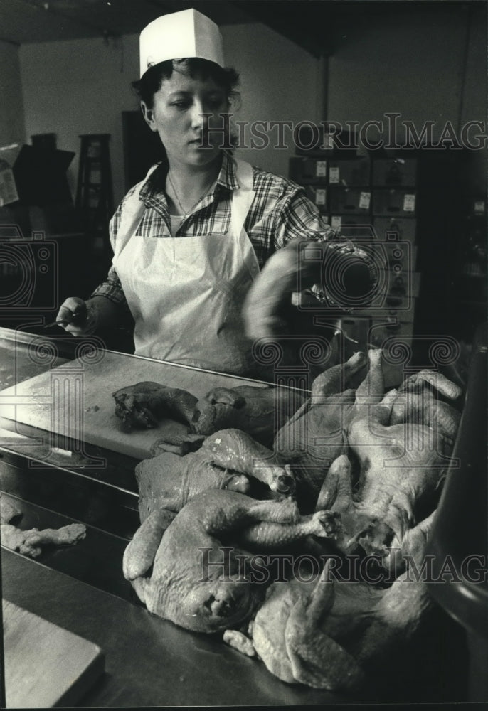 1991, Violet Kulas, Tower Chicken, cutting up chicken - mjc10567 - Historic Images