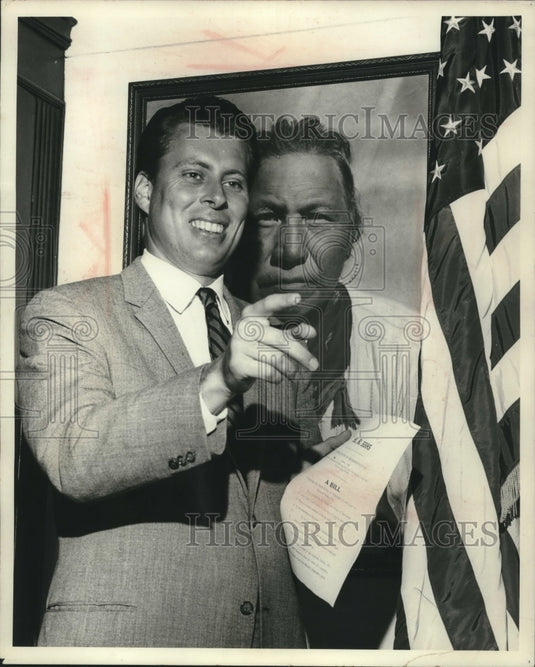 1985, Representative John V. Tunney in front of father's portrait - Historic Images