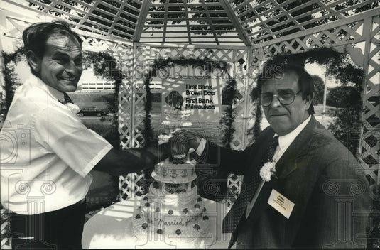 1988, Dean Treptow & James Robert celebrate bank merger, Wisconsin - Historic Images