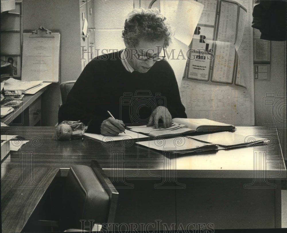 1961, Nobel Prize winner, Dr. Howard M. Temin, works at his desk - Historic Images