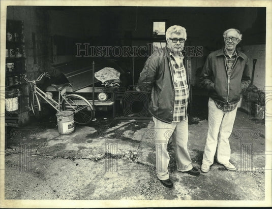 1982 Milwaukee's Peter Tarantino & companion in his garage - Historic Images