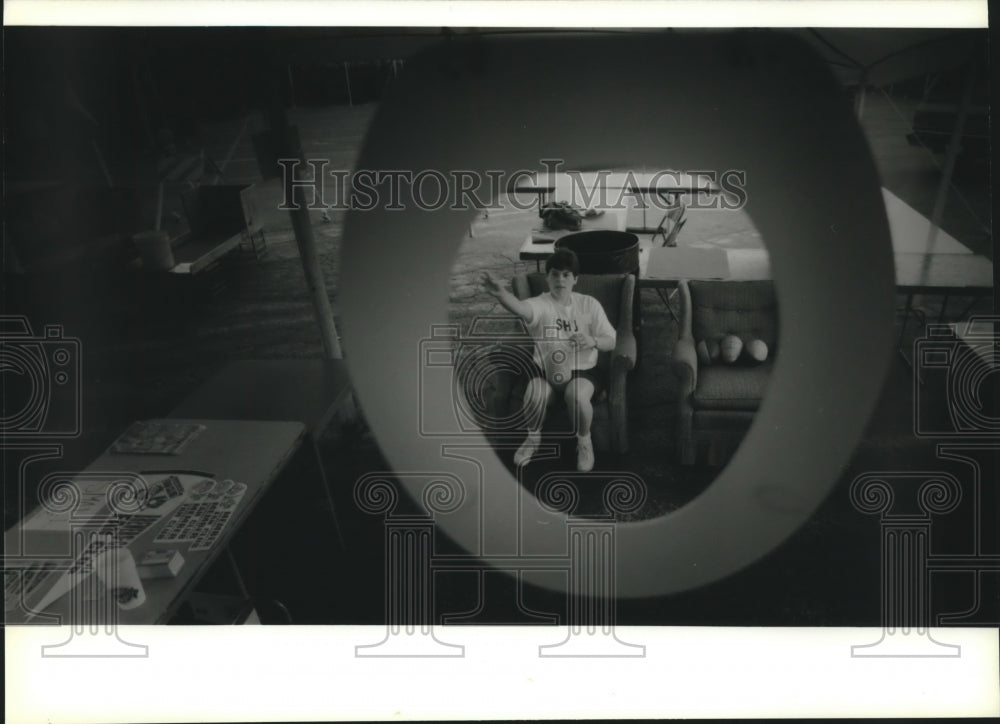 1994 Lisa Barczyk tries a game at Sacred Heart church festival - Historic Images