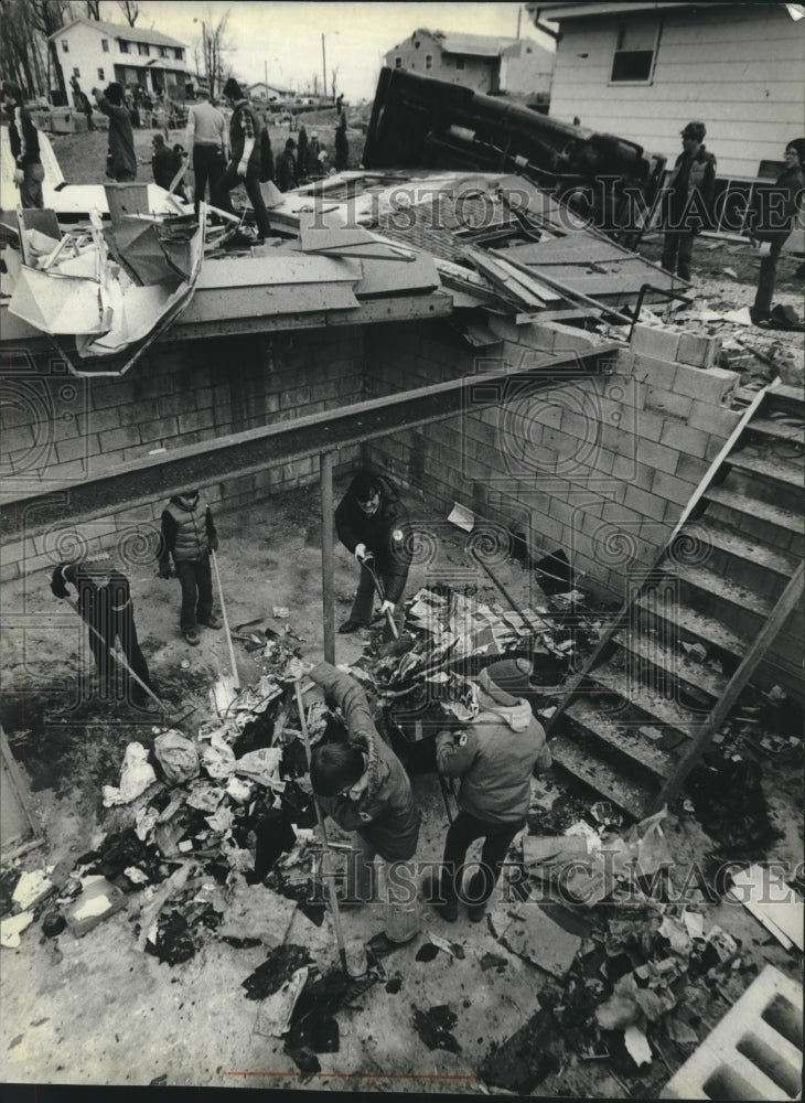 1981 Volunteers cleared debris from a basement in Wisconsin - Historic Images