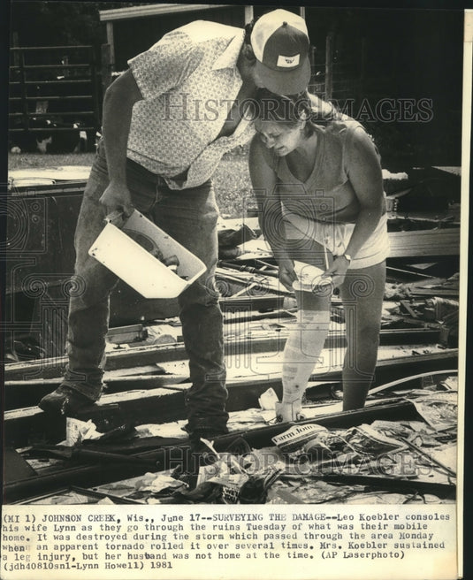 1981, Leo Koebler consoles his wife Lynn after tornado, Wisconsin - Historic Images
