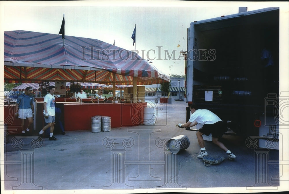 1993, Worker Removes Barrels From Truck for Summerfest - mjc11066 - Historic Images