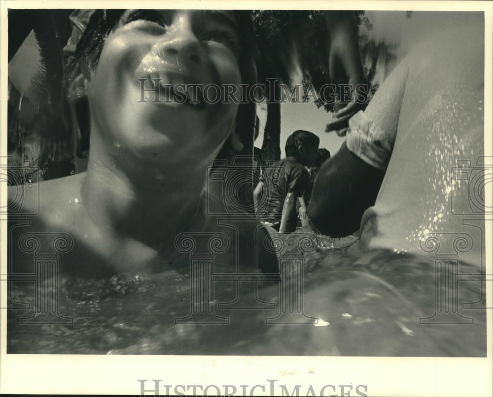 1987 Boy Having Fun With Others at Walker Square Park Wading Pool - Historic Images
