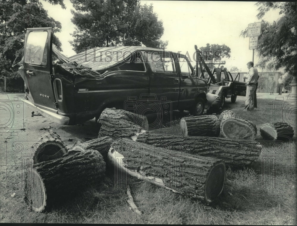 1983 Elsie Miller's van crushed by tree in storm in Oconomowoc, WI - Historic Images