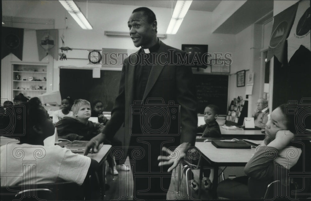 1994, Father Wilson Dindi Magero of Kenya spoke at 27th Street School - Historic Images