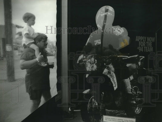1993, Gunnar Hogflet, Chicago, & his son, Peter, peek at theater - Historic Images