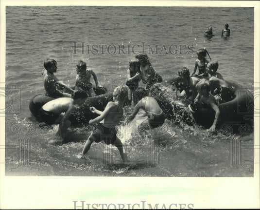 1983, Children playing in water at Sundance Campgrounds near Barnes - Historic Images