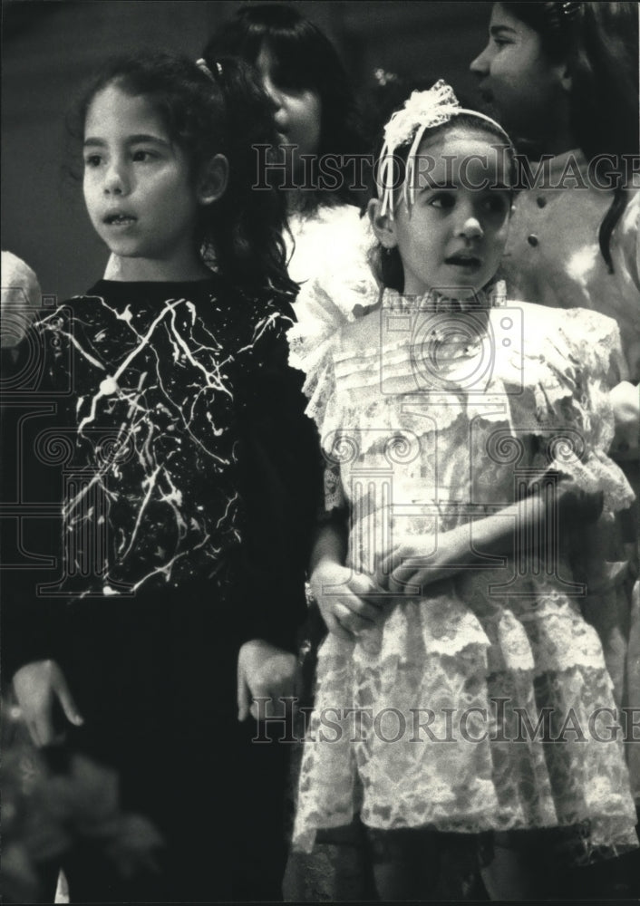 1991, First graders at 27th Street School sing "Feliz Navidad" - Historic Images