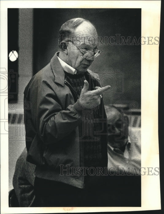1990, Bayside, WI trustee Bill Stuckey asks question at meeting - Historic Images