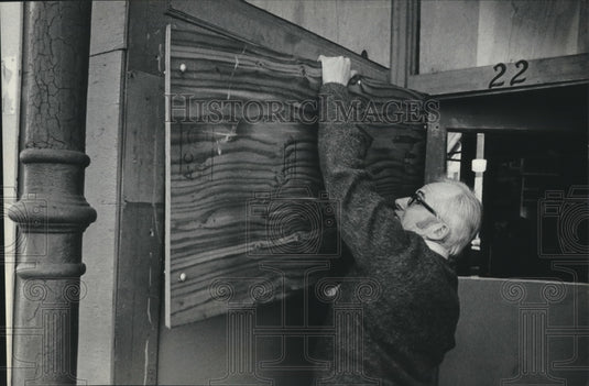 1975, Teacher, John Steeves unboards windows in Hortonville, WI - Historic Images